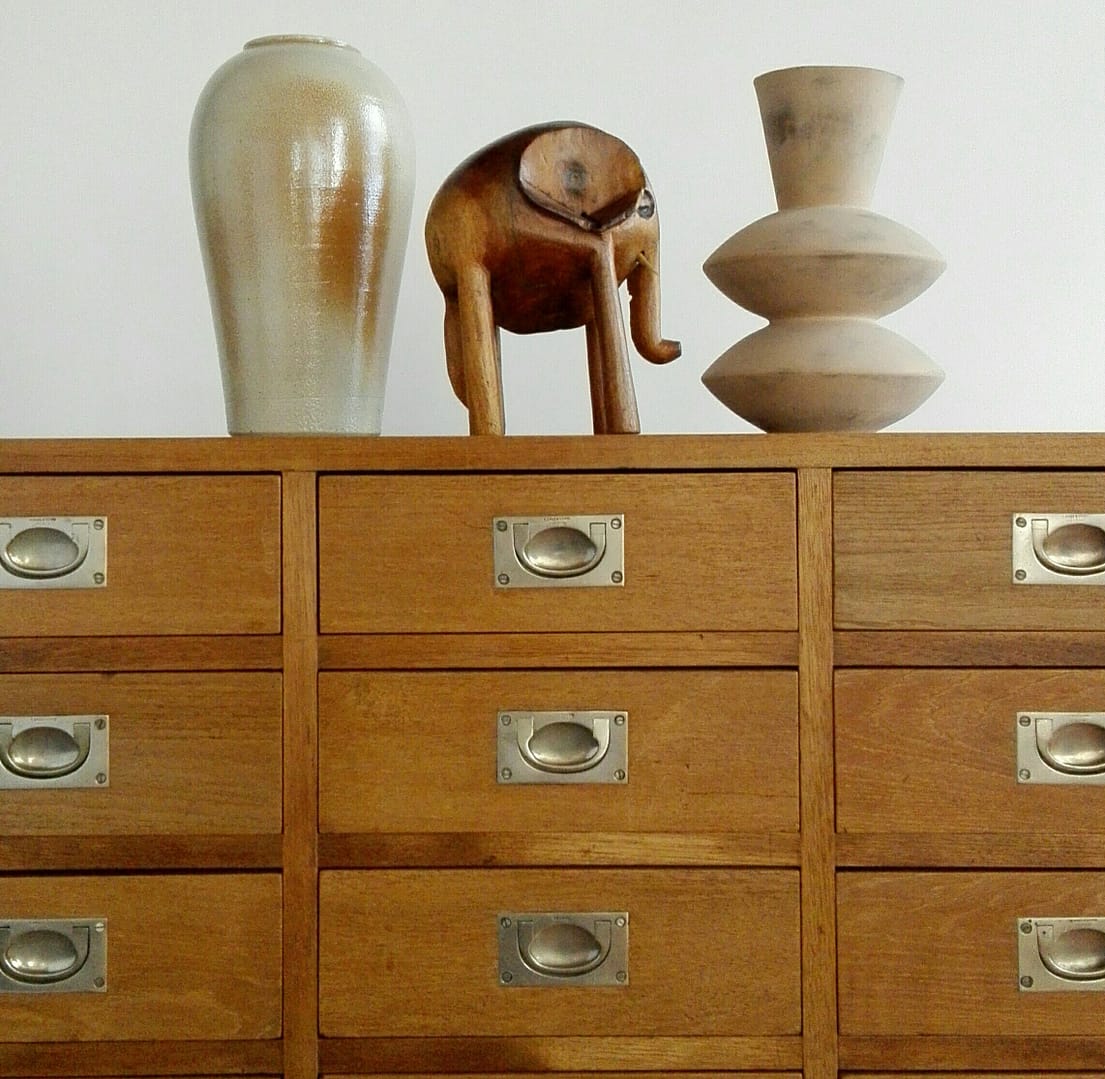 Cabinet made from reclaimed teak with brass handles