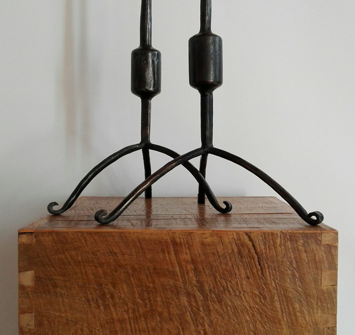 Pair of wrought iron candlesticks