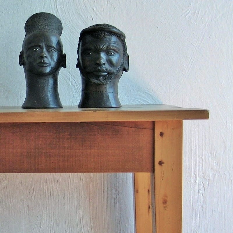 Pair of clay African heads